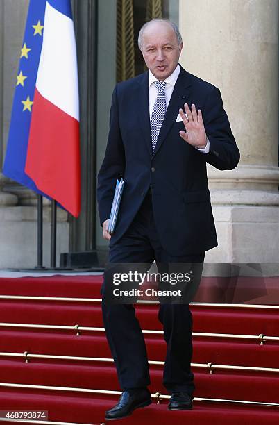 Laurent Fabius, French Minister of Foreign Affairs and International Development leaves the Elysee Palace after a meeting with French President...