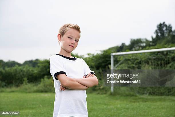confident boy in soccer jersey - kid arms crossed stock pictures, royalty-free photos & images