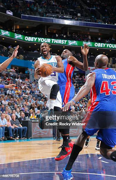 Kemba Walker of the Charlotte Hornets goes up for the shot against Joel Anthony of the Detroit Pistons on April 1, 2015 at Time Warner Cable Arena in...