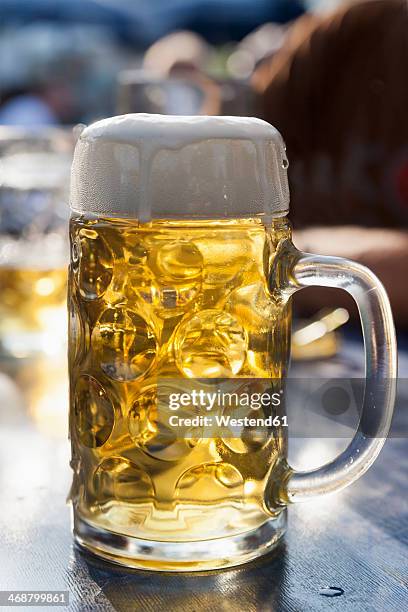 germany, munich, one liter of beer - beer stock-fotos und bilder