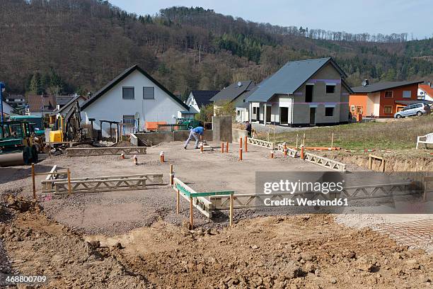 germany, rhineland-palatinate, house building, earth works, laying pipes before pouring the concrete of foundation - building foundations stock pictures, royalty-free photos & images