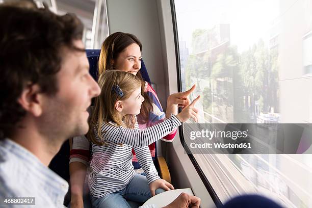 happy family in a train - passenger train fotografías e imágenes de stock