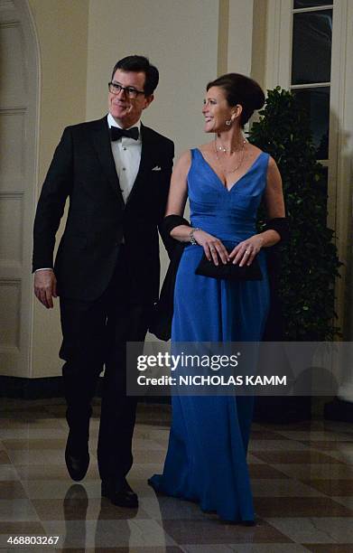 Comedian Stephen Colbert and his wife Evie arrive at the White House in Washington on February 11, 2014 for the state dinner in honor of French...
