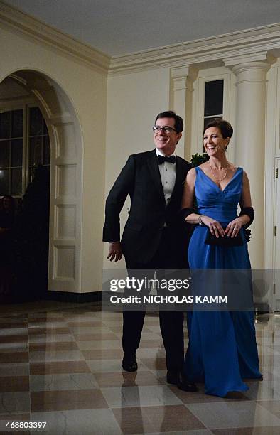 Comedian Stephen Colbert and his wife Evie arrive at the White House in Washington on February 11, 2014 for the state dinner in honor of French...