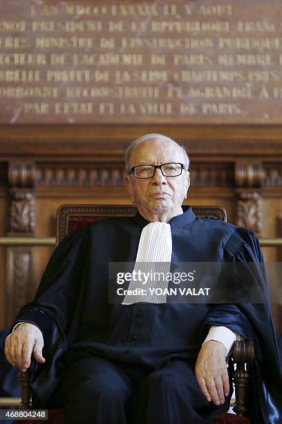 Tunisian President Beji Caid Essebsi listens to speeches on April 7, 2015 during a ceremony at the Sorbonne University in Paris at the start of his...