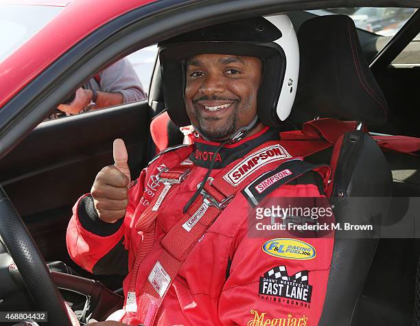 Alfonso Ribeiro gives a thumbs up to photographers during the 38th Annual Toyota Pro/Celebrity Race Press Day at the Toyota Grand Prix of Long Beach...