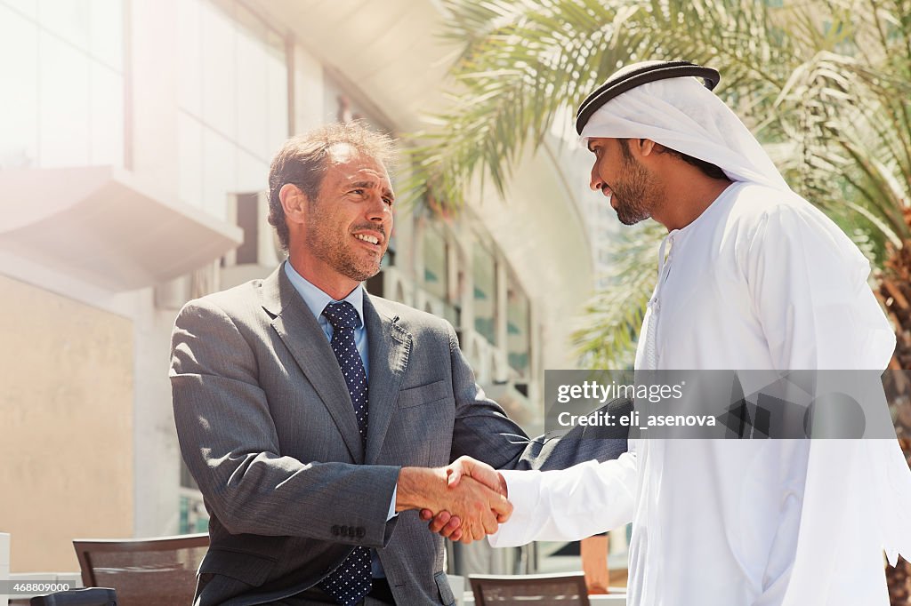 Two businessmen struck a deal in Dubai