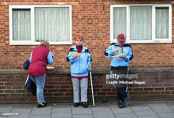 Fans enjoy a pre-match refreshments prior to the Barclays Premier League match between Aston Villa and Queens Park Rangers at Villa Park on April 7,...
