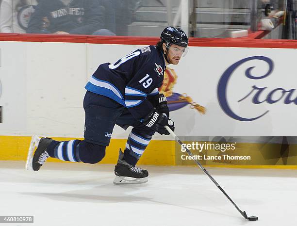Jim Slater of the Winnipeg Jets plays the puck up the ice during second period action against the New York Rangers on March 31, 2015 at the MTS...