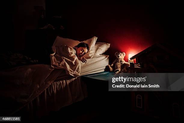 night light - girl in her bed stock pictures, royalty-free photos & images