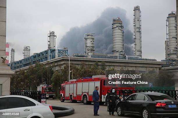 Smoke billows out of chemical storage facilities half a day after an explosion at Dragon Aromatics paraxylene plant injuring fourteen people on April...