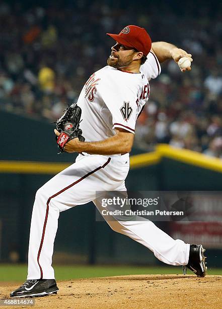 Starting pitcher Josh Collmenter of the Arizona Diamondbacks pitches against the San Francisco Giants during the Opening Day MLB game at Chase Field...