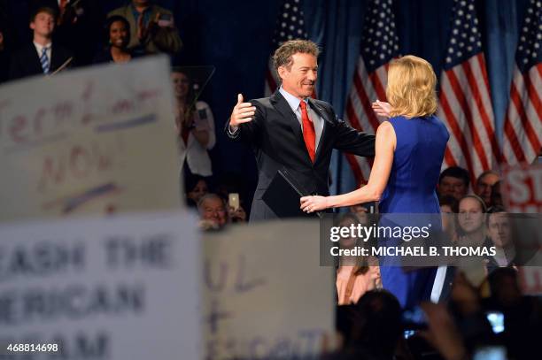 Senator Rand Paul greets his wife, Kelley Paul, prior to speaking to supporters during the kickoff of the National Stand with Rand tour on April 7,...