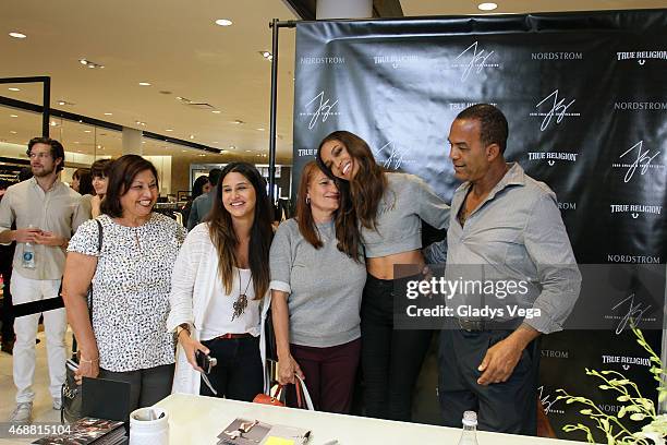 Joan Smalls posed with her parents and friends as part of True Religion event at Nordstrom San Juan on April 4, 2015 in San Juan, Puerto Rico.