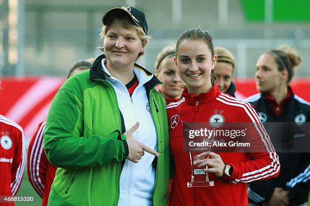 Sara Daebritz is awarded best German player in the Algarve Cup during a Germany training session ahead of their friendly match against Brazil at...