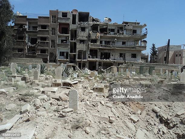 Syrian regime forces stage air strike at the Yarmouk refugee camp in Damascus, capital of Syria on April 7, 2015. A graveyard in the camp is...