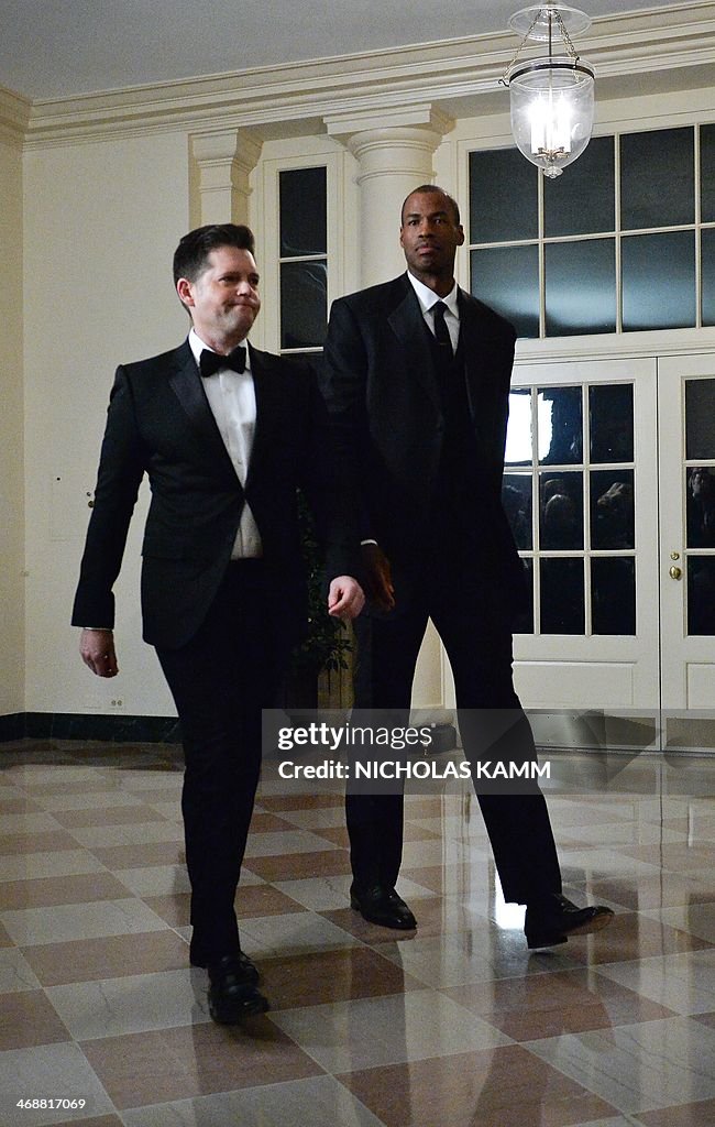 NBA player Jason Collins and Brunson Green arrive at the White House ...