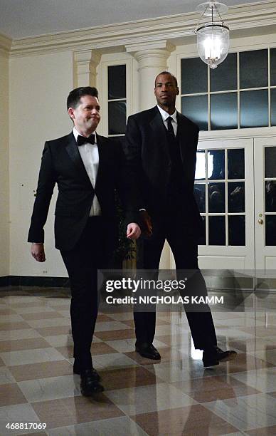 Player Jason Collins and Brunson Green arrive at the White House in Washington on February 11, 2014 for the state dinner in honor of French President...