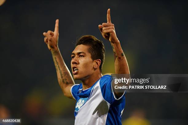 Hoffenheim's Brazilian midfielder Roberto Firmino celebrates during the German Football Cup DFB Pokal quarter-final match between Borussia Dortmund...