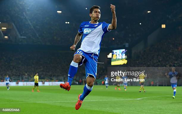 Roberto Firmino of 1899 Hoffenheim celebrates after scoring his teams second goal during the DFB Cup Quarter Final match between at Borussia Dortmund...