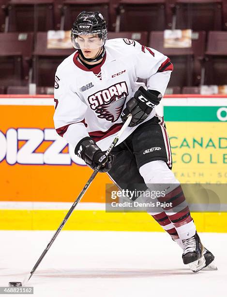 Defenceman Brock Philips of the Guelph Storm moves the puck during warmups prior to a game against the Windsor Spitfires on March 12, 2015 at the...