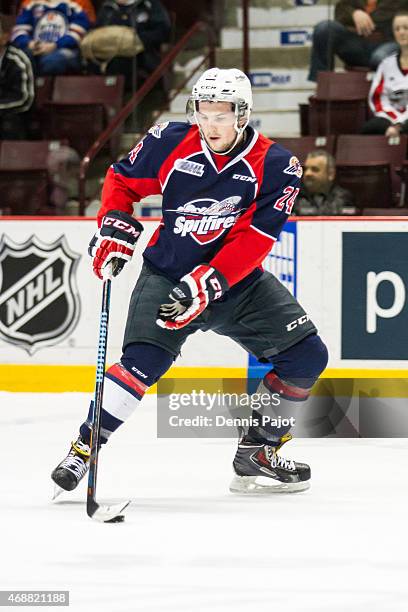 Forward Graeme Brown of the Windsor Spitfires moves the puck against the Guelph Storm on March 12, 2015 at the WFCU Centre in Windsor, Ontario,...
