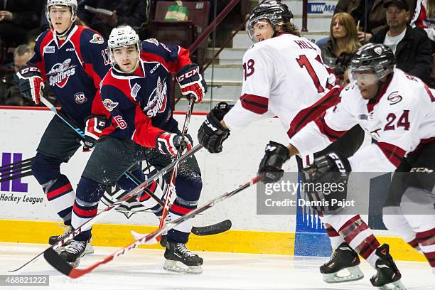 Forward Sam Povorozniouk of the Windsor Spitfires moves the puck against the Guelph Storm on March 12, 2015 at the WFCU Centre in Windsor, Ontario,...