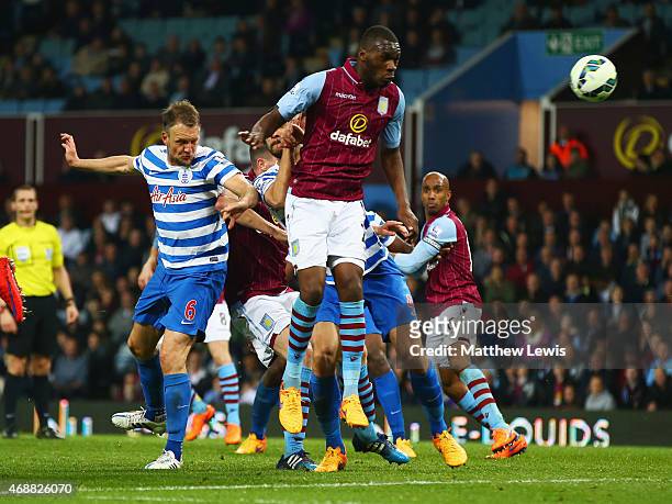 Clint Hill of QPR scores their second goal with a header during the Barclays Premier League match between Aston Villa and Queens Park Rangers at...