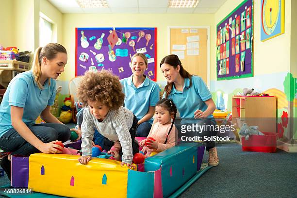 ball pool fun - daycare stock pictures, royalty-free photos & images