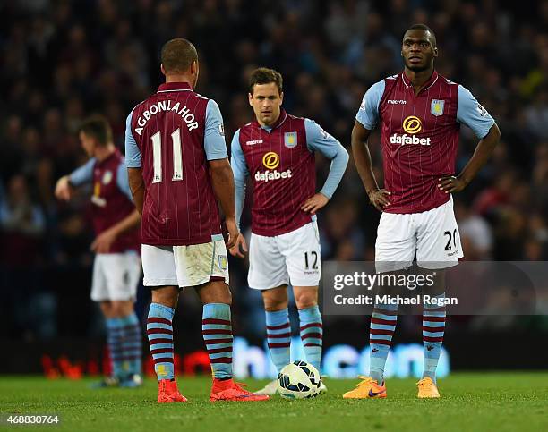 Gabriel Agbonlahor, Joe Cole and Christian Benteke of Aston Villa look dejected as Charlie Austin of QPR scores their third goal during the Barclays...