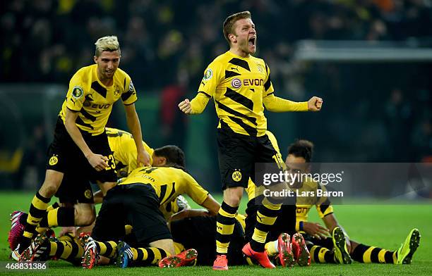 Jakub Blaszczykowski of Borussia Dortmund celebrates after team mate Sebastian Kehl scored his teams third goal during the DFB Cup Quarter Final...