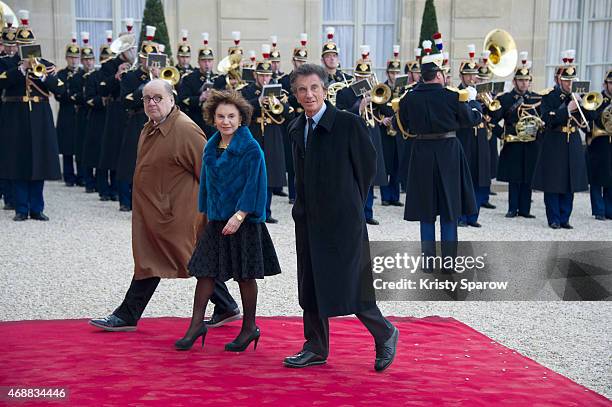 French journalist and director Serge Moati arrives with President of the Arab World Institute Jack Lang and his wife Monique Buczynski for a state...