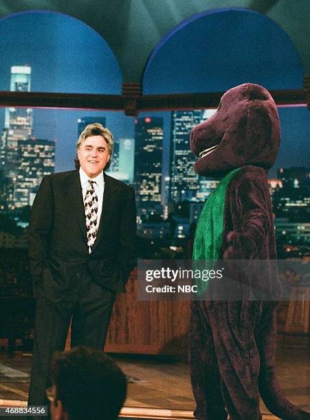 Episode 952 -- Pictured: Host Jay Leno and Barney during the monologue on June 26, 1996 --