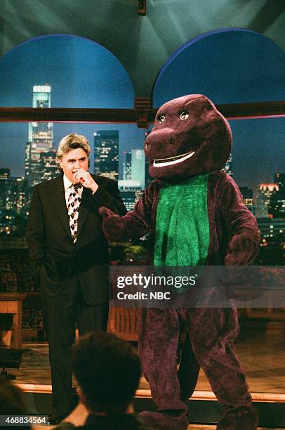 Episode 952 -- Pictured: Host Jay Leno and Barney during the monologue on June 26, 1996 --