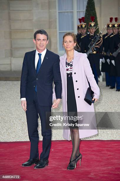 French Prime Minister Manuel Valls and his wife Anne Gravoin arrive to the State Dinner in honor of Tunisian President Beji Caid Essebsi at Elysee...