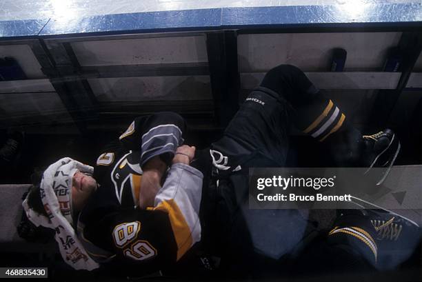 Jaromir Jagr of the Pittsburgh Penguins rests on the bench before an NHL game against the New York Rangers on March 21, 1999 at the Madison Square...