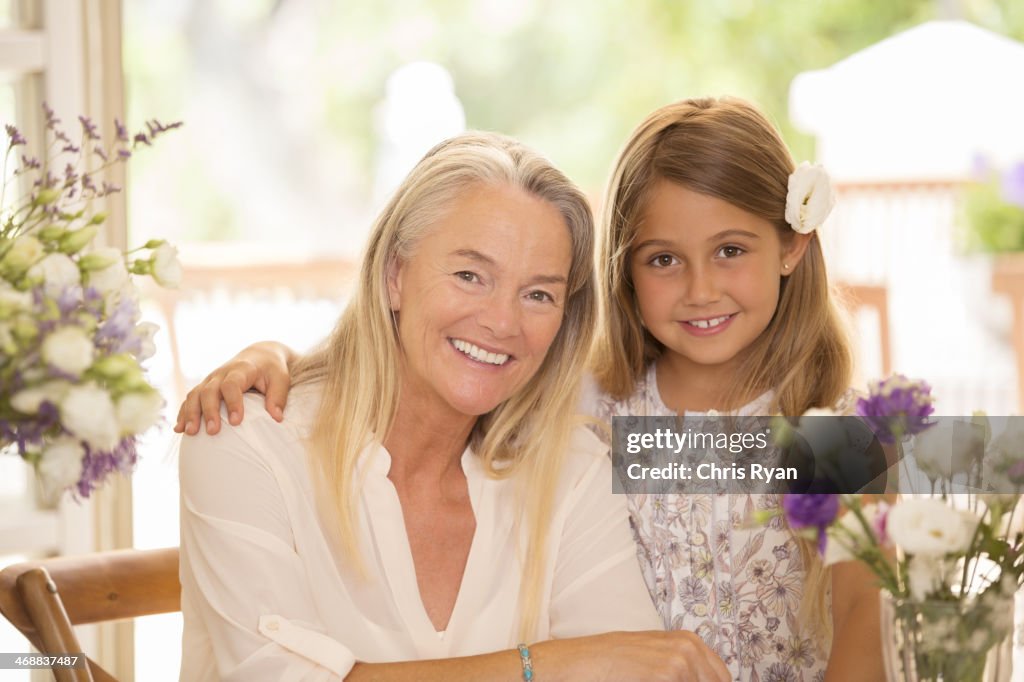 Grandmother and granddaughter smiling