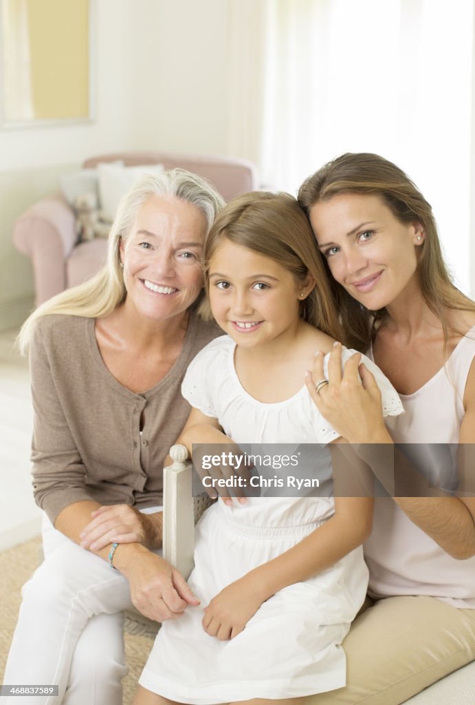 Multi-generation women smiling in bedroom