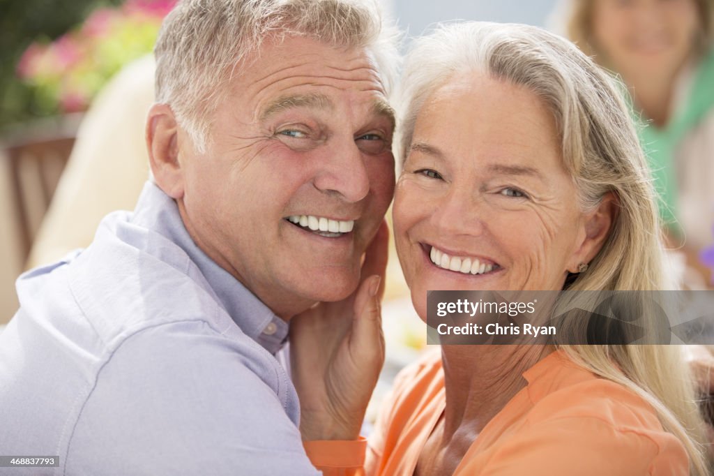 Senior couple smiling outdoors