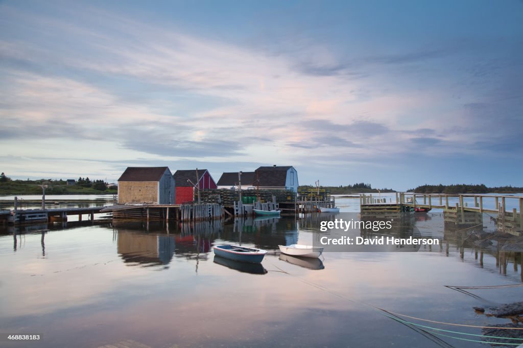 Rowboats and buildings on calm bay