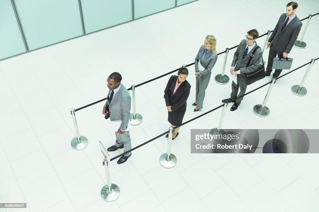 Business people waiting in line