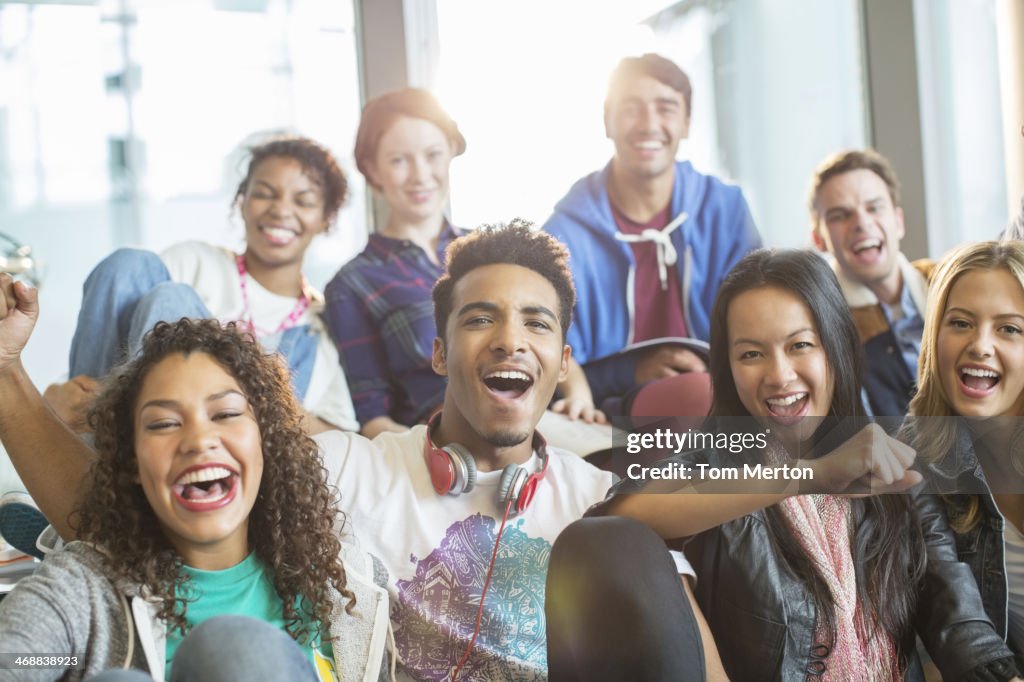 Friends cheering together indoors