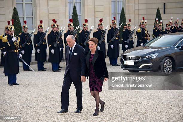 French Foreign Minister Laurent Fabius and his companion Marchand Baylet arrive for a state dinner in honor of the Tunisian President Beji Caid...