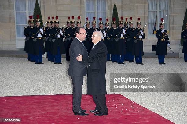 French President Francois Hollande honors Tunisian President Beji Caid Essebsi during a State Dinner at the Elysee Palace on April 7, 2015 in Paris,...