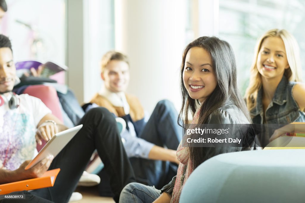 University students smiling in lounge