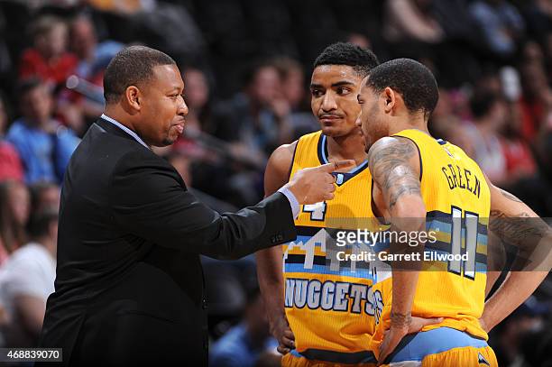 Melvin Hunt, Gary Harris, and Erick Green of the Denver Nuggets speak during a game against the Los Angeles Clippers on April 4, 2015 at the Pepsi...