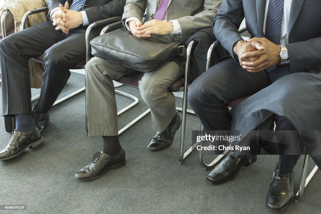 Businessmen sitting in waiting area