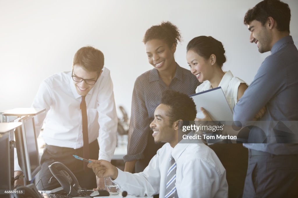 Business people working at computer in office
