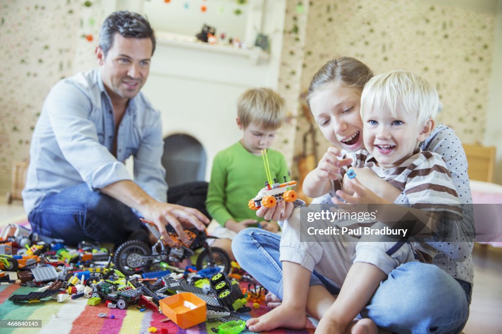 Father and children playing together