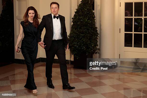 Elon Musk, co-founder and chief executive officer of Tesla Motors Inc., right, and Talulah Musk arrive to a state dinner hosted by U.S. President...